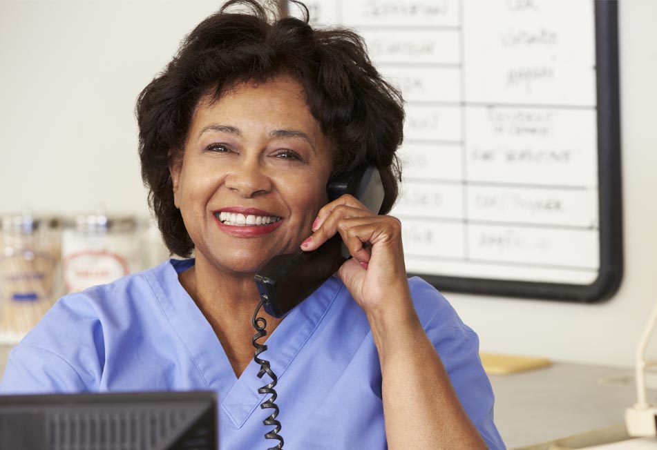 Home Care Professional Talking on the Phone and Smiling