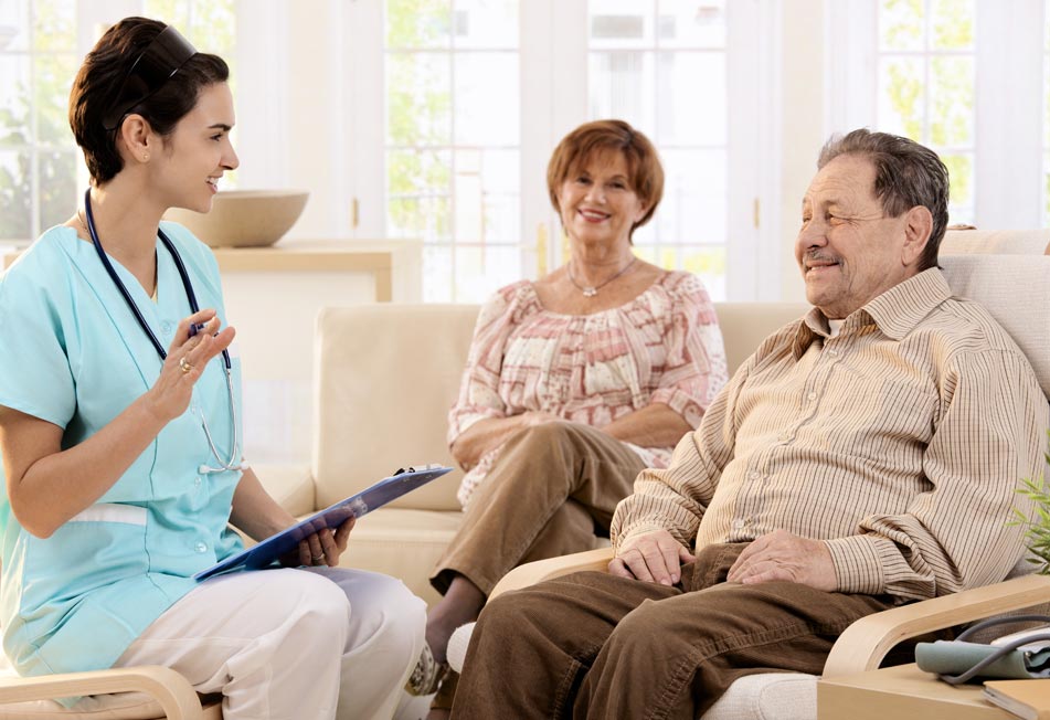 Home Care Professional Talking to an Elderly Couple