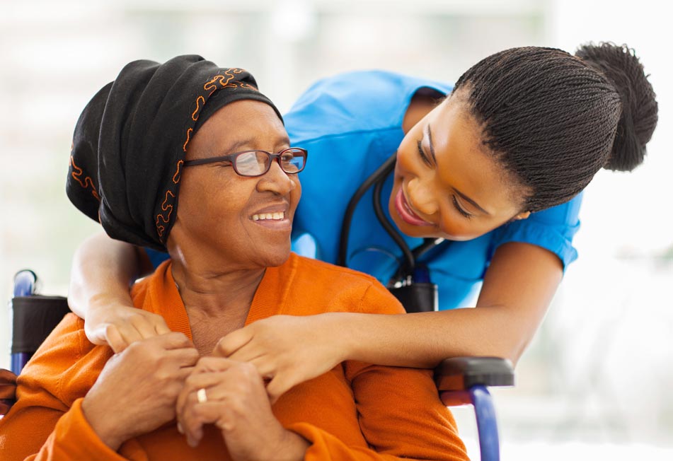 Home Care Professional Talking to an Elderly Woman