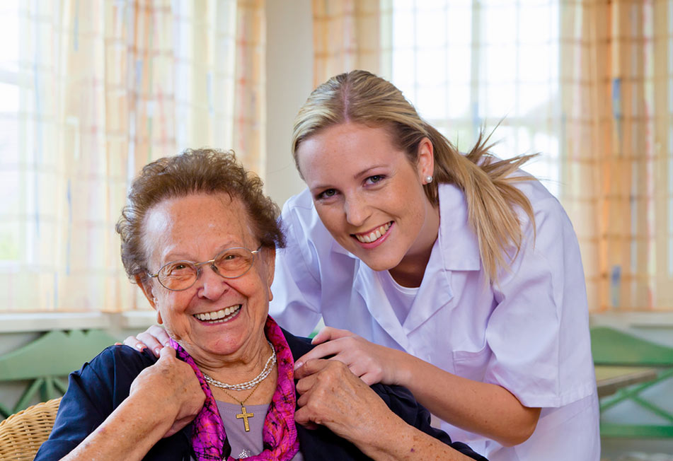 Home Care Professional and Elderly Woman Smiling